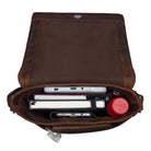 Open brown leather messenger bag vertical with filled compartments top view