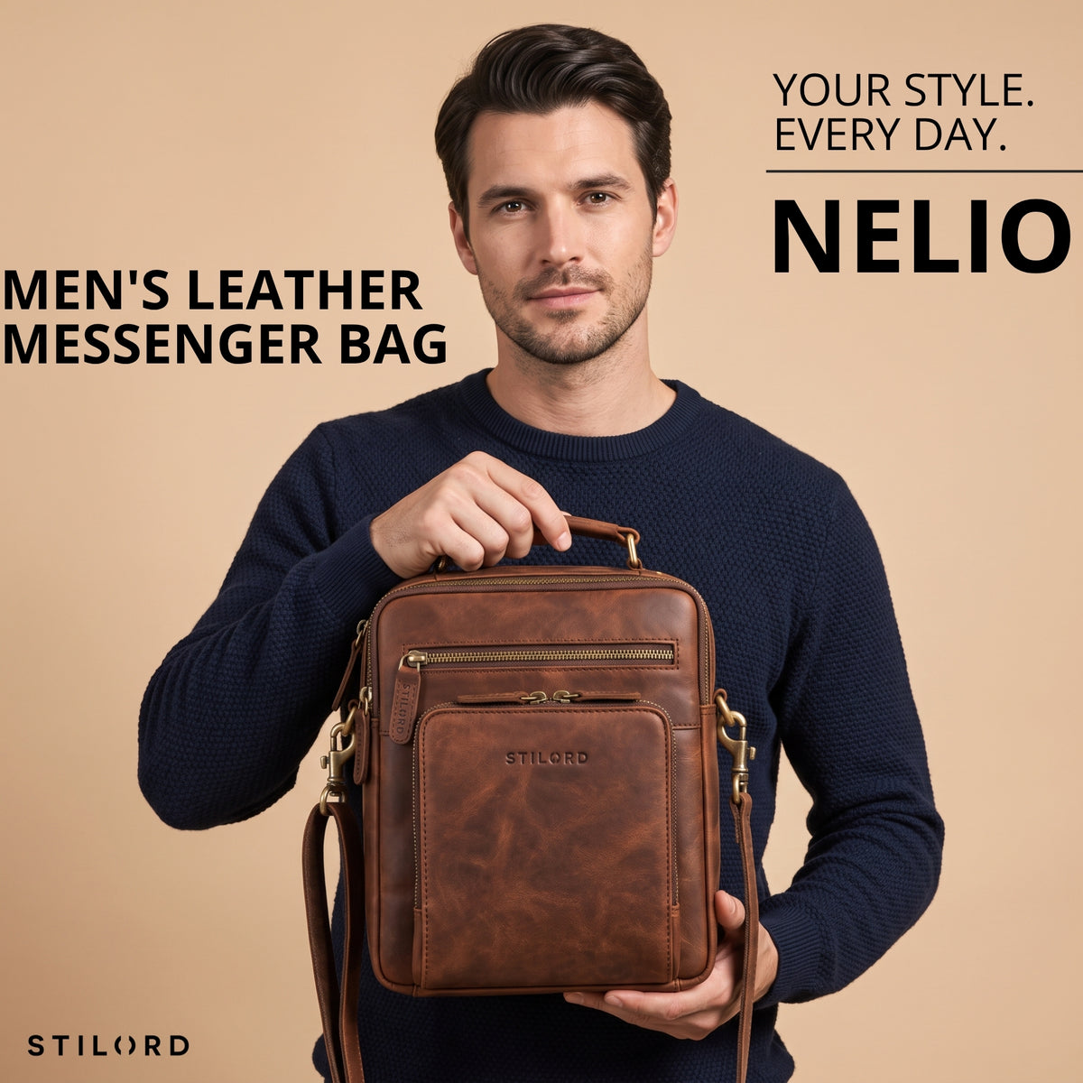 Small men's brown leather messenger bag with top handle, embossed STILORD logo on front pocket, held by model, front view