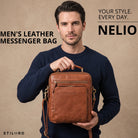 Small leather messenger bag maraska brown with top handle held by man, STILORD embossing visible