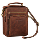 Small brown leather shoulder bag zamora, front view with top handle, detachable shoulder strap and embossed STILORD logo